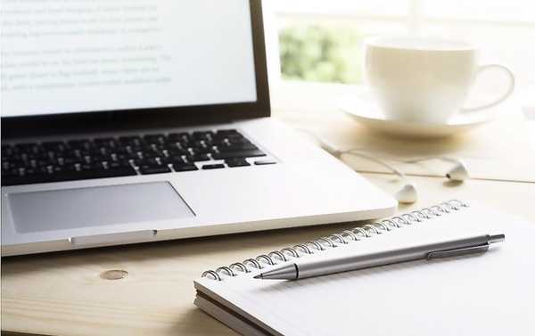 A notebook and pen on a table, suggesting a gentle reflection moment
